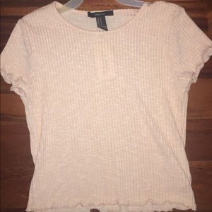 light pink crop top with ruffles at the end